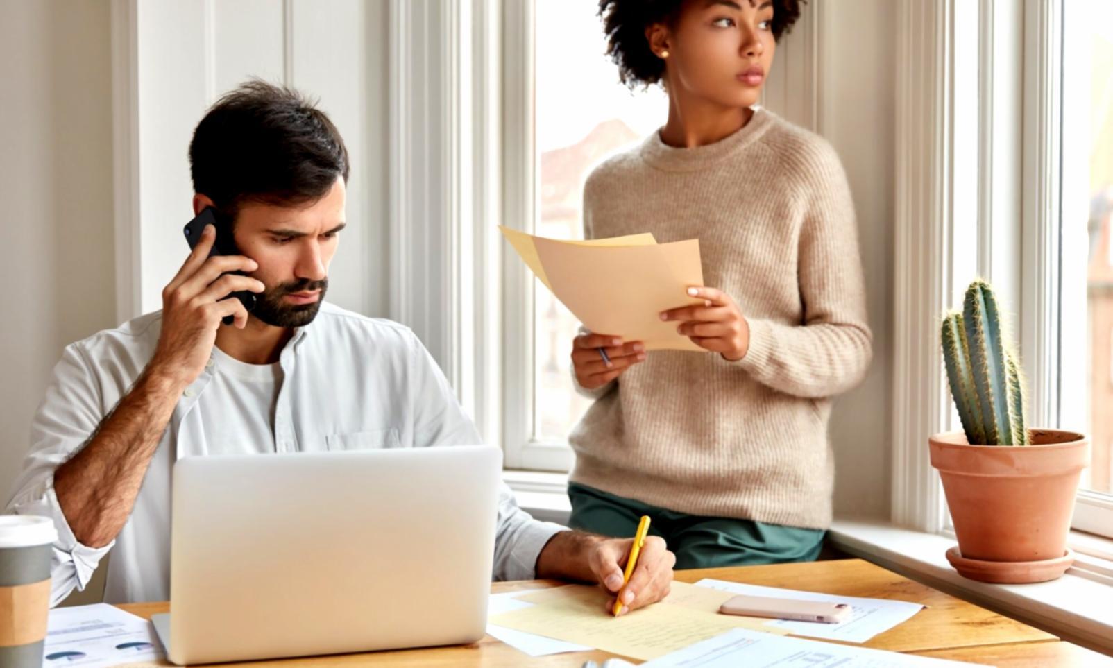 Trading analysis workspace with multiple monitors displaying market charts and data